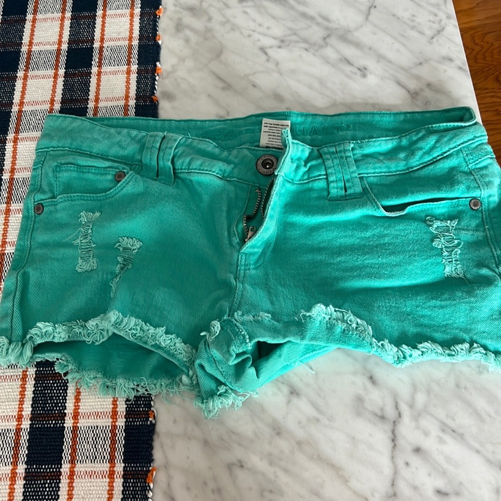 Blue asphalt. Size 11. Teal shorts